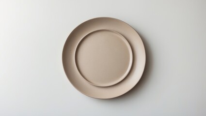 Poster - Isolated White Background Featuring a Top View of a Trendy Circle Beige Sand Grain Texture Ceramic Dish