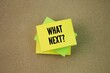 © Fauzi - Colored paper with the word question What's Next? next step concept