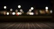 © Siasart - Blurred City Lights Over a Dark Brown Wooden Table Surface