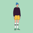 © ikhwan - flat design vector illustration, A man wearing a blue beanie, black sweater, yellow shorts, knee-high socks, and green shoes is standing casually on a green background