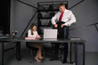 © Sergey - Smiling female financial advisor, attorney lawyer or bank manager consulting client investor working in office reading document at business meeting reviewing legal paper file planning