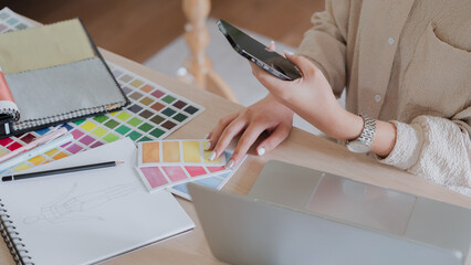 Fototapete - Creative designer woman taking notes and working about graphic design on laptop in home studio