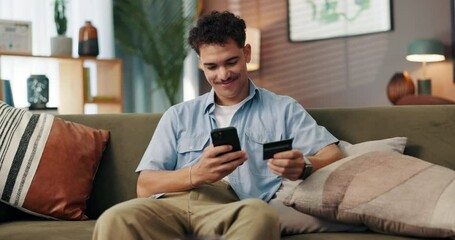 Fototapete - Man, phone and credit card on sofa, online shopping and easy payment with mobile app for deal on web. Person, smartphone and fintech with smile, discount or sale with ecommerce in lounge at apartment