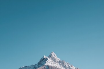 Poster - minimalistic shot of majestic mountain peak under clear blue sky offering abundant copy space