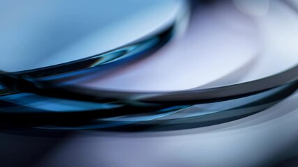 Poster - abstract blue circle intersecting. transparent curved lines. glass rings overlapping with light refl