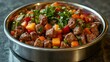 © MABRUR - Hearty beef and vegetable stir-fry in a metal bowl