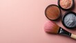 ©  zikakant - An aesthetic arrangement featuring makeup powders and brushes on a soft pink surface, showcasing beauty essentials for a fresh, stylish makeup application experience.