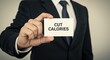 © singgih - Cut Calories Card Held by Man