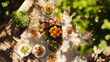 © Maofeng - An overhead view of a beautifully arranged outdoor meal, perfect for a sunny summer gathering.