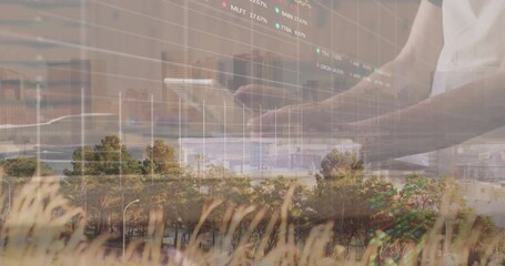Poster - man tapping tablet in park blend, showing animated stock market graphs and grass skyline overlay