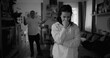 © Marco - Woman contemplating deeply during heated argument, while man in background gestures in frustration, highlighting tension and unresolved issues in a couple’s relationship