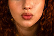 © ADDICTIVE STOCK - Close-up of lips with vibrant red curly hair