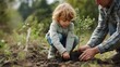 © Adel - A young child and an adult planting a small tree together in a garden setting on a sunny day outdoors