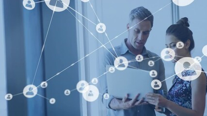 Poster - coworkers using laptop indoors, viewing animated network user icons in technology office