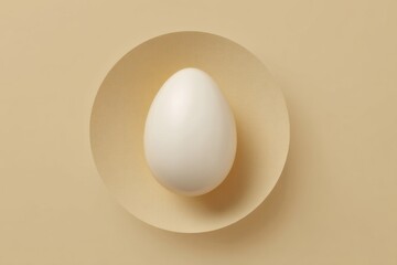 Poster - Minimalist Design Featuring a Single White Egg Shape Centered on a Soft Beige Background Creating Serene Visual Harmony Generative AI