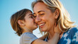 © DruZhi Art - Elderly Woman with Grandchild in Park – Loving Kiss and Embrace During Piggyback Ride for Family Memories, Grandmother Stories, and Motherhood Journey