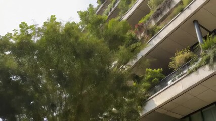 Aufkleber - A closeup view of a building corner with staggered balconies and strategically p vegetation promoting natural light tration while creating shaded outdoor spaces.