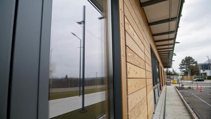 Poster - A medium closeup of a wall panel constructed from engineered wood emphasizing its grain flexible connections and ecofriendly materials engineered for earthquake resilience.