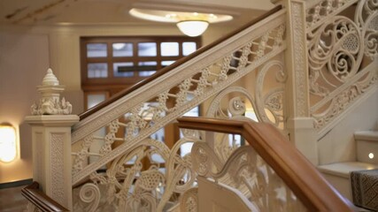 Poster - A medium closeup view of an intricate 3Dprinted balustrade showcasing the filigree detail and lightweight construction set against a natural light source that highlights its