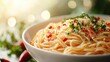 © pornpong - Close-up of a bowl of freshly cooked spaghetti pasta garnished with chopped herbs and red pepper flakes on a bright table with natural light