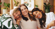 © AchillesReel25/peopleimages.com - Senior woman, daughter and granddaughter in home, bonding or portrait with connection on sofa. Happiness, laughing with female people and healthy relationship, generations and support in family house