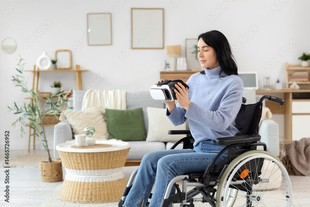 Beautiful young woman in wheelchair with VR glasses at home Stock Photo ...
