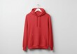 © Creative experience  - Red hoodie hanging on a white hanger against a white background