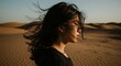 © AleniaFlow - Woman with Windblown Hair in Desert Landscape