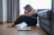 © Charlie's - Sad woman with fat upset bored of dieting Weight loss fail  Fat diet and scale sad asian woman on weight scale at home weight control.