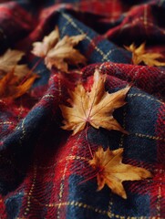 Poster - Beautiful Tartan Pattern Fabric With Dried Maple Leaves Arranged Carefully on Top for a Cozy Autumn Feel Generative AI
