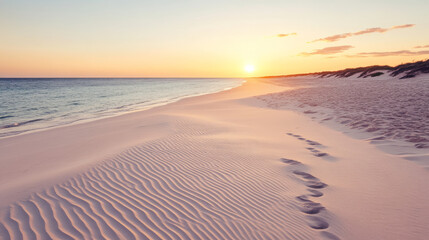 Wall Mural - serene beach scene sunset, showcasing gentle waves lapping against shore, with soft sand patterns an