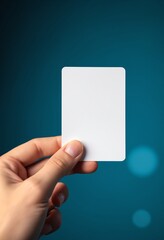 Poster - A hand holds a blank white card against a blue background with soft circular light effects
