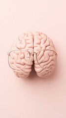 Poster - Neural network model with glasses lies on light pink surface. Top view of brain structure used in artificial intelligence algorithms.
