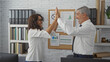 © Krakenimages.com - Man and woman celebrating success with a high five in a modern office environment, showcasing teamwork, collaboration, and professional attire in an interior workspace setting.
