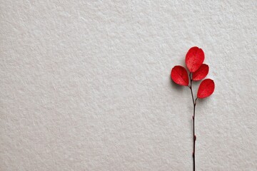 Aufkleber - Single Red Leaf Resting on Textured Paper Background Evokes a Sense of Simplicity and Tranquility in Minimalistic Design Generative AI