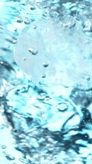 Fototapete - Super slow motion of rotating ice cubes in water. Filmed on high speed cinema camera, 1000 fps. Underwater composition. Vertical aspect ratio.
