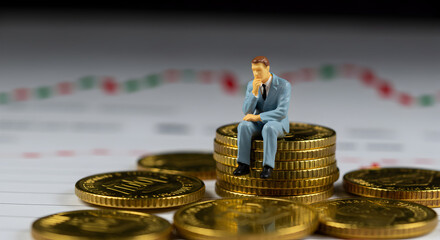 Poster - Worried Miniature Businessman Sits Atop Gold Coins Stack with Financial Chart Illustration Risk and Investment Concept