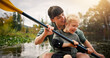 © peopleimages.com - Kayak, mother and child with support in lake, water activity and adventure for bonding together. River, mom and girl with paddle to learn canoeing, travel holiday and rowing outdoor as family in boat