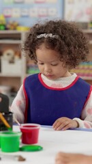 Poster - Classroom, painting and girl with creativity, kid and artistic with education, motor growth and kindergarten. Child development, student and craft in school, lesson and project with fun activity