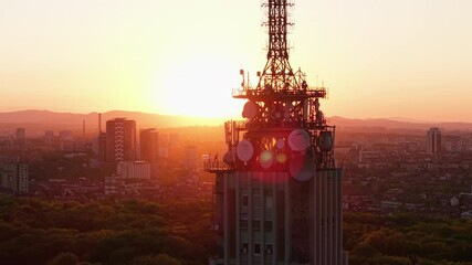 Wall Mural - Cinematic Aerial View of Sofia Bulgaria at Sunset TV Tower and Green City Parks in Golden Light