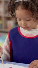 Aufkleber - Learning, child and painting for art at school with paintbrush, creativity and picture with color. Education, girl or kid with activity for development with paint and paper for kindergarten artwork