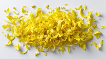 Poster - Bright yellow lemon zest strips are scattered freely on a white surface, showcasing their curved shapes and vibrant texture, complemented by sharp lighting