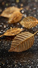 Poster - Leaf resting on a table with a shimmering gold leaf surface creating a relaxed atmosphere