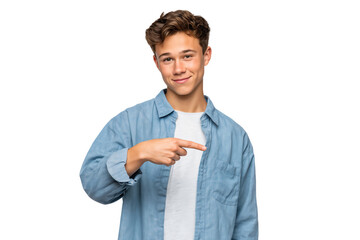 Poster - Smiling handsome boy confidently pointing to the side, suggesting direction, idea, or focus, isolated on white background