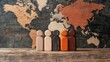 © nattapon - Wooden figurines of diverse colors stand against a world map background, representing inclusivity and diversity, Ideal for projects on global unity, teamwork, or cultural representation,