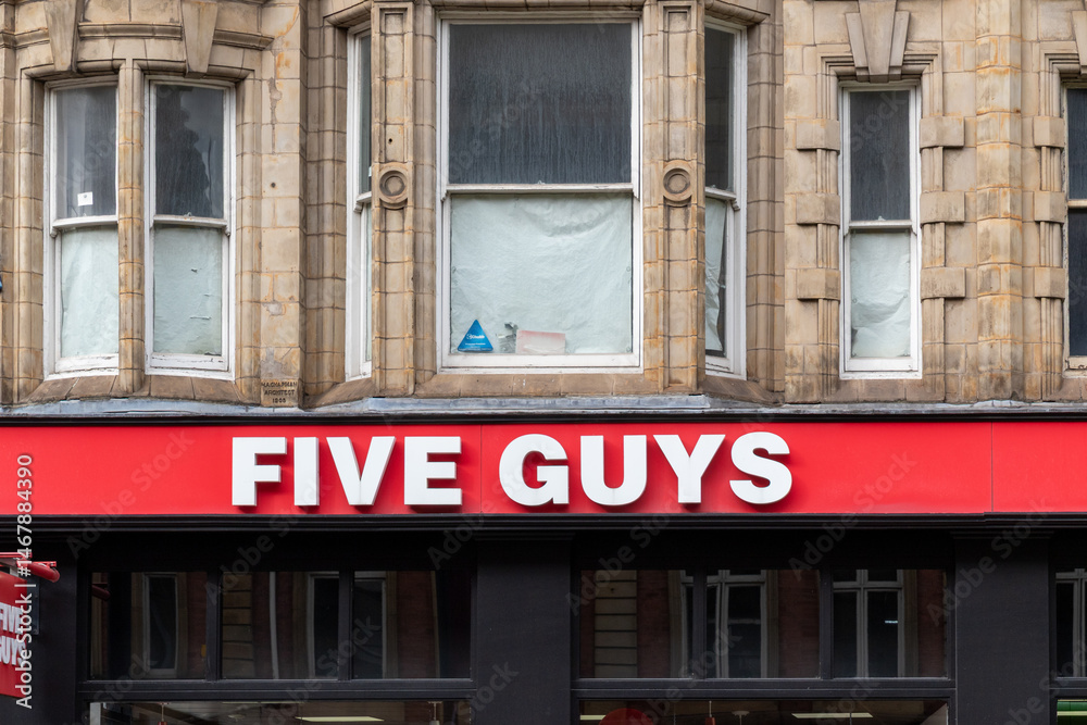 Five Guys Restaurant Facade with Windows and Red Sign in Leeds, UK ...