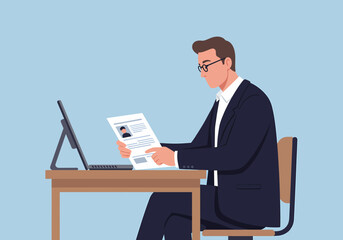 Poster - Business Man Reviewing Documents At His Desk Indoors