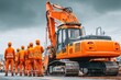 © BOONJUNG - Large tracked excavator rotating on construction site while workers observe the operation process