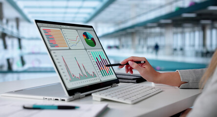 Poster - Female Data Analyst Analyzing KPI Dashboard On Laptop