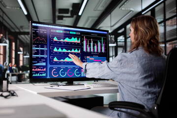 Leinwandbilder - Female Business Analyst Examining Market Trends